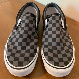 Black and grey checkered slip on vans